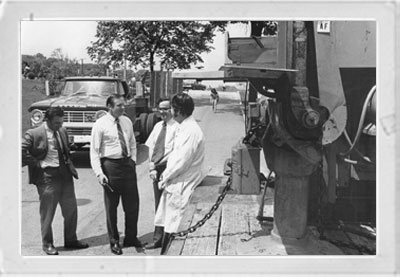 Armstrong (center with a pipe) talks to UC Department of Aerospace Engineering faculty in 1972.