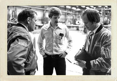 Neil Armstrong, left, Mark Stear, and Pete Reynolds review the results of one of the trial runs at Learjet, February 1979. Photo Courtesy of Mark Stear, BSAsE, '78. Featured in the Aerospace Engineering Newsletter, November 2012